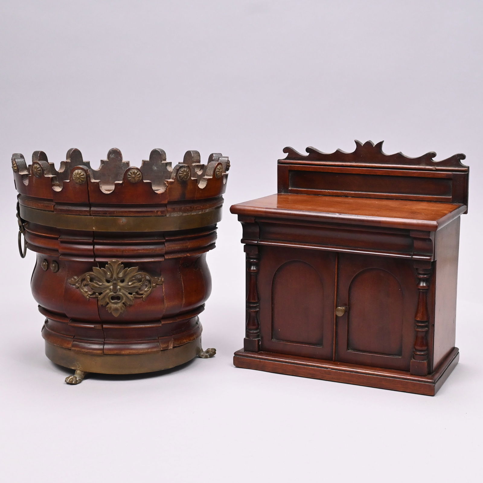 Dutch Mahogany Wine Bucket & Classical Tea Caddy: Dutch Mahogany Brass-Bound Wine Bucket or Cooler and an American Classical Tea Caddy, 19th Century. The staved wine bucket with molded sides and raised on brass paw feet, the crenellated rim applied