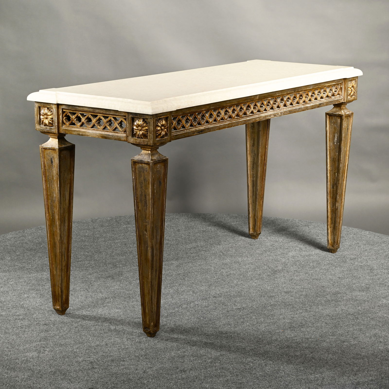 Louis XVI Style Trellage Sofa Table, Limestone Top: Louis XVI Style Trellage Sofa Table with Limestone Top, 20th Century. The rectangular limestone top above a pierced trellis diaperwork apron, raised on panelled square tapered legs headed by