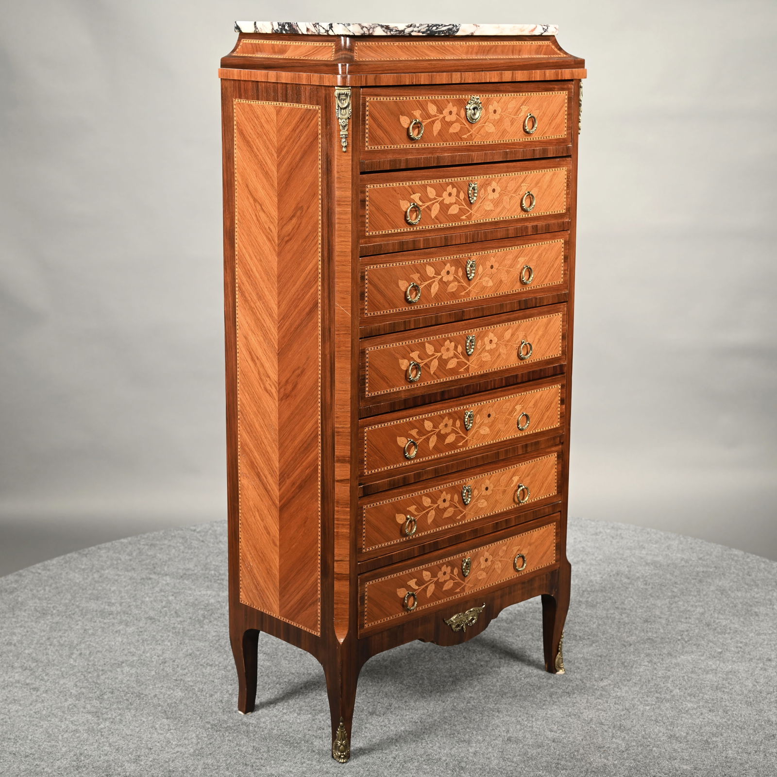Italian Napoleon III Style Marquetry Semainier: Italian Napoleon III Style Marquetry Inlaid Marble-Top Semainier or Lingerie Chest. The oblong marble top above a cove molded frieze over a gilt-metal mounted case of seven floral-marquetry inlaid