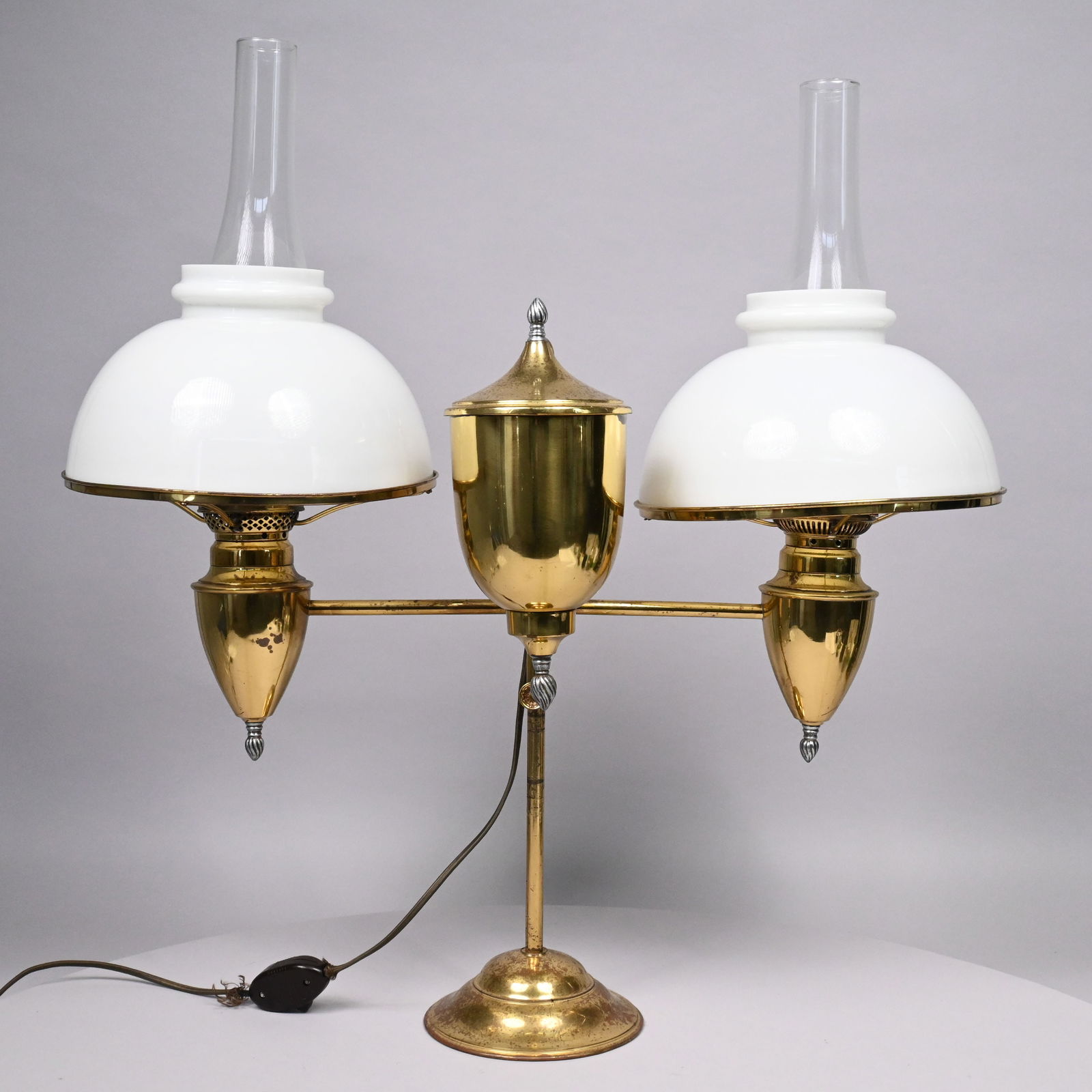 American Brass Double Student Lamp, B & H: American Brass Adjustable Double-Arm Student Lamp, Bradley & Hubbard Mfg. Co., Meriden, Connecticut, Late 19th Century. Fitted with a removable acorn-shaped tank, the weighted base cast with the "B &