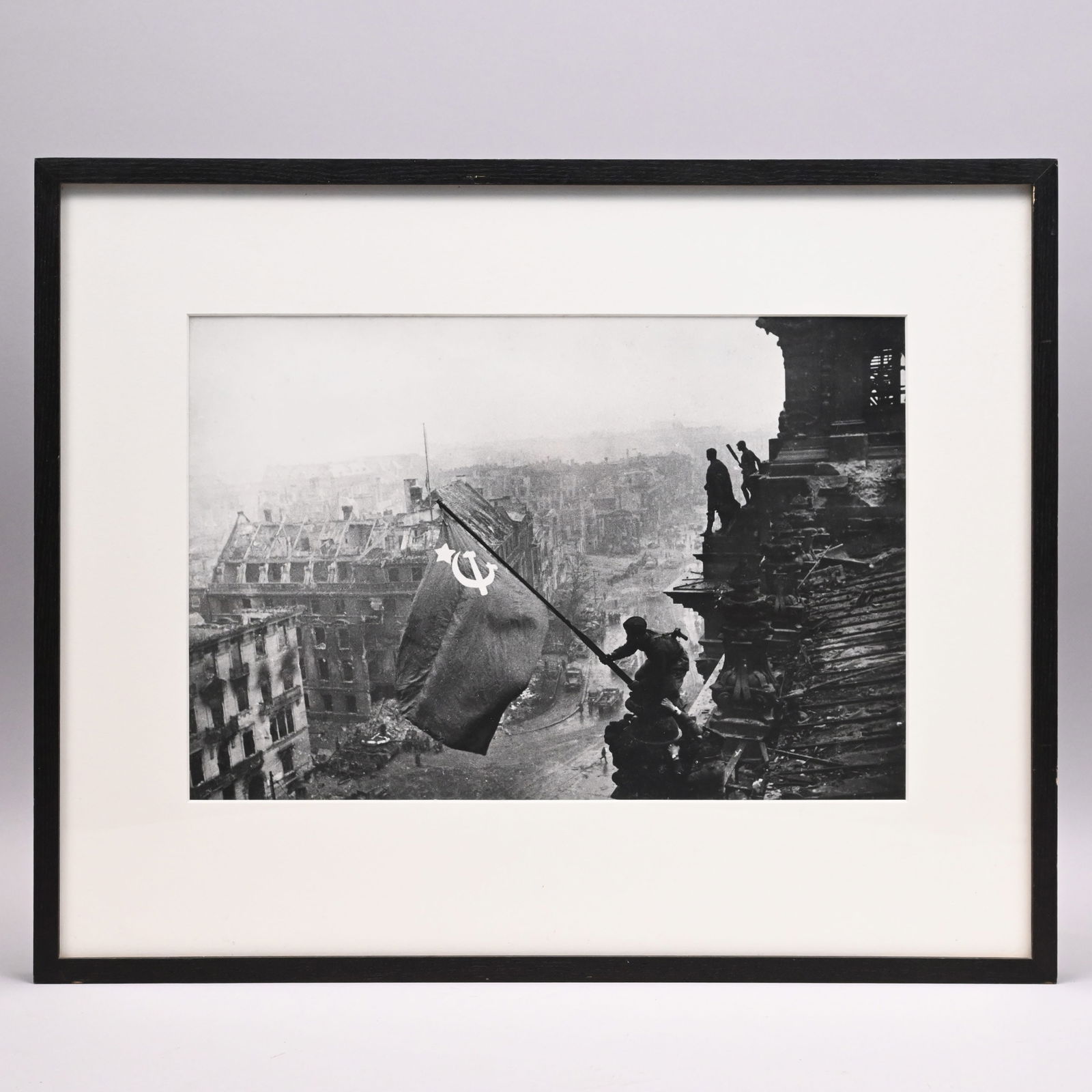 Yevgeny Khaldei- Raising the Flag on the Reichstag: Yevgeny Ananyevich Khaldei (Russian, 1917 - 1997). "Raising the Flag on the Reichstag," Berlin, May 2, 1945. Gelatin silver print, (9.75 x 14.5 inches, sight).Frame: H: 16.625 in., W: 20.625 in., D:
