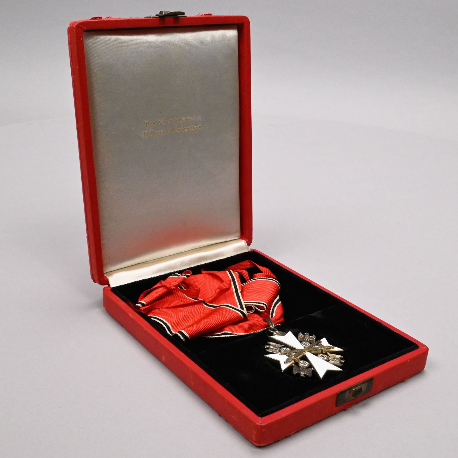 Order of the German Eagle Medal, Third Class: Order of the German Eagle Medal, Third Class with Swords, Attributed to Gebruder Godet & Co., Berlin, 1943. The obverse a maltese cross in white enamel and silver-gilt, between the arms four silvered