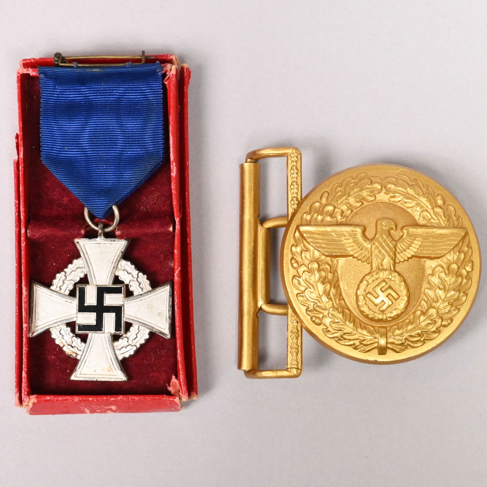 Two German World War II NSDAP Medals: Two German World War II NSDAP Medals, 1938-1940. Comprising a 25-year Civil Service Faithful Service medal with ribbon pin, instituted in 1938 by Adolf Hitler, possibly by Franz Reischauer, the