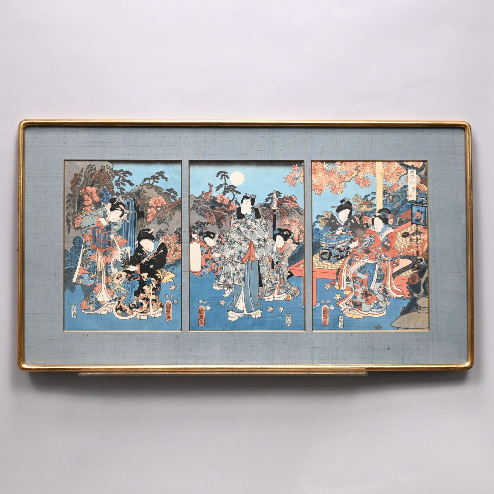 Utagawa Kuniteru - Triptych of Geisha: Utagawa Kuniteru. Woodblock Print Triptych of Geisha Attending a Warrior. Ink on paper, signed and titled, (14 x 9.75 inches, sight), framed as one with silk matboard frame.Frame: H: 21 in., W: