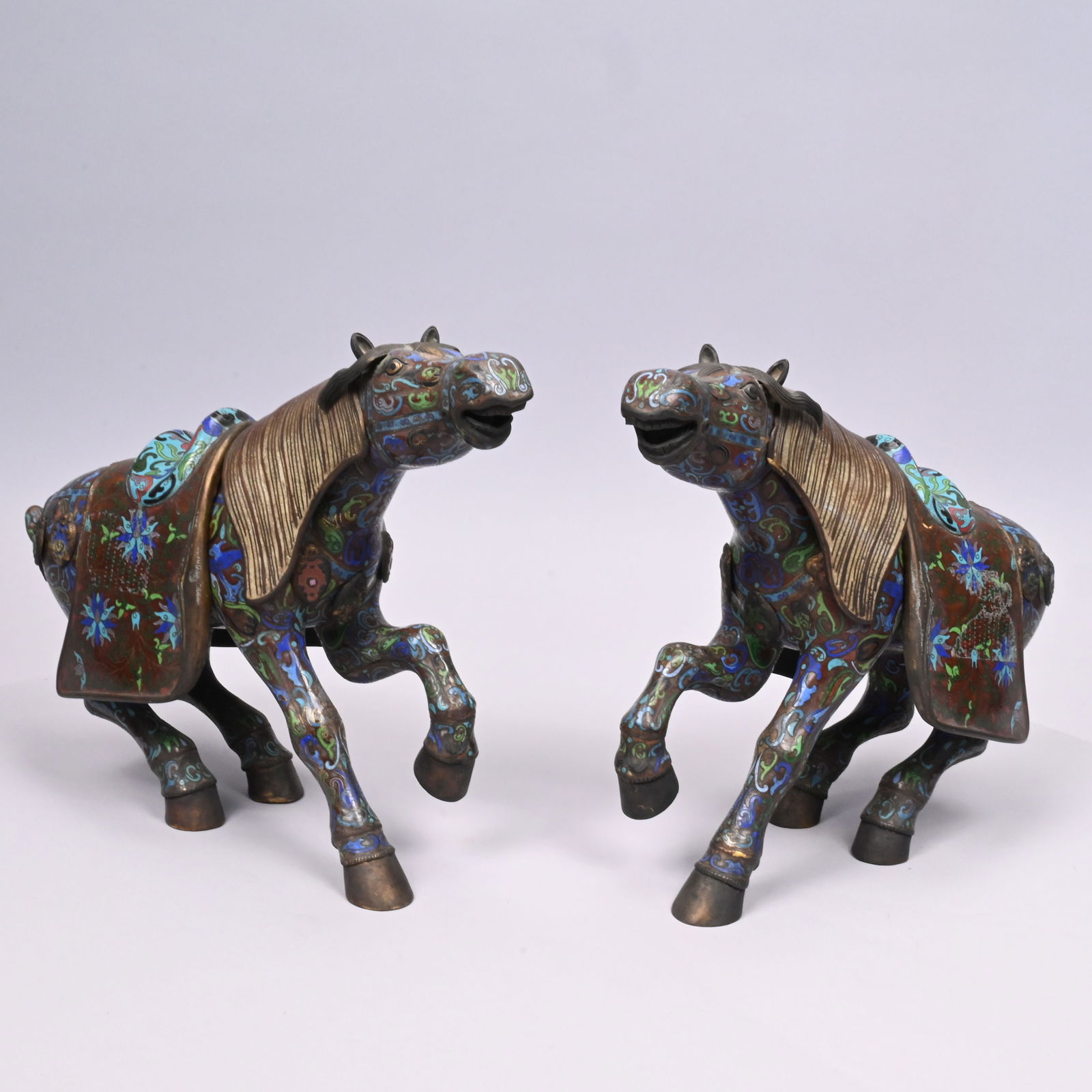 Pair of Chinese Cloisonne Enamel Horse Censers: Pair of Chinese Cloisonne Enamel Horse Censers, Guangxu. Each with removable mane and saddle, applied with a rosette behind the saddle and the harness fitted with moving medallions, enamelled in