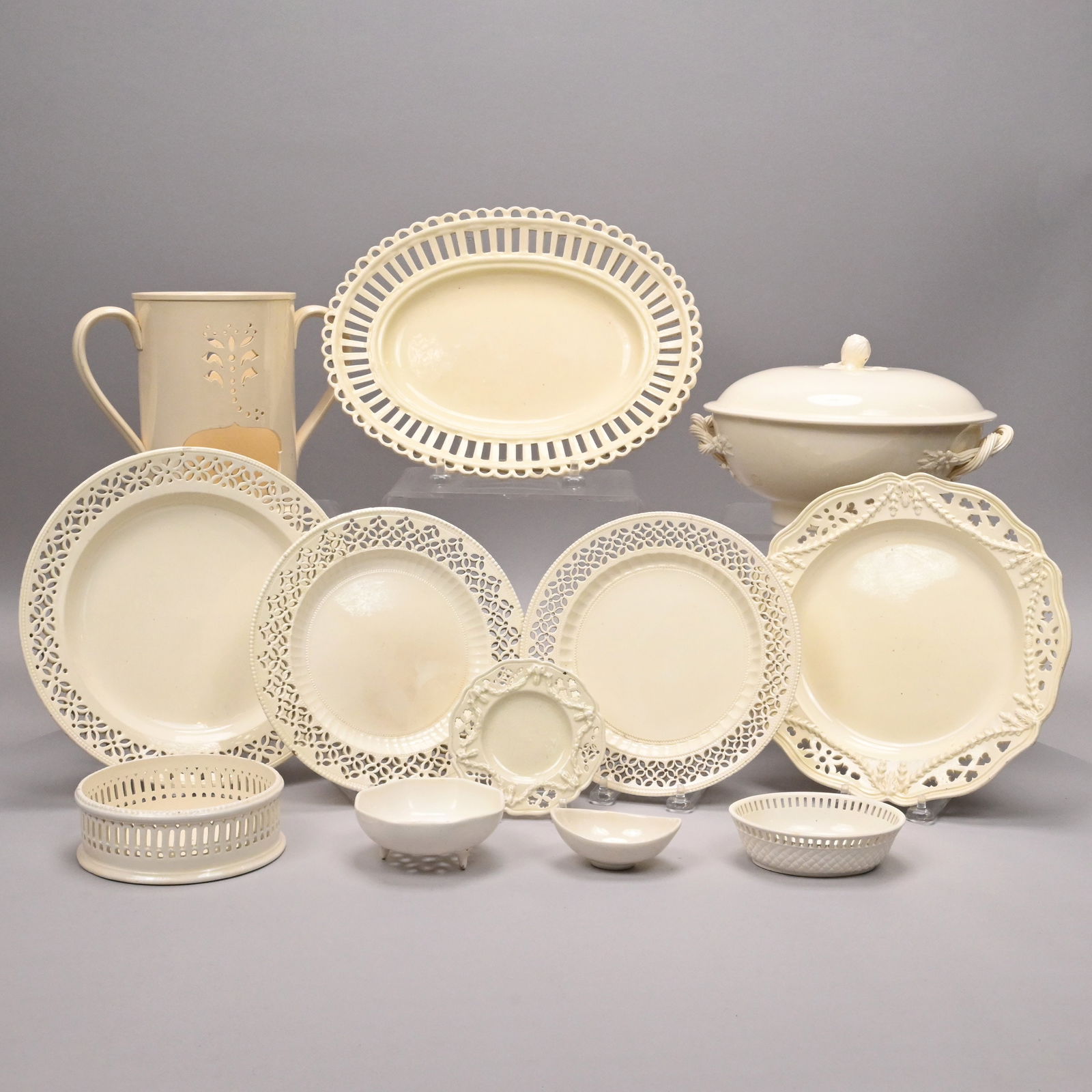 Grp English Creamware Serving Articles & Russian: Group of English Creamware Serving Articles and a Russian Veilleuse, Late 18th-19th Century. Comprising a serving bowl and cover with fruit stem finial, unmarked; a platter, probably Thomas Godwin,