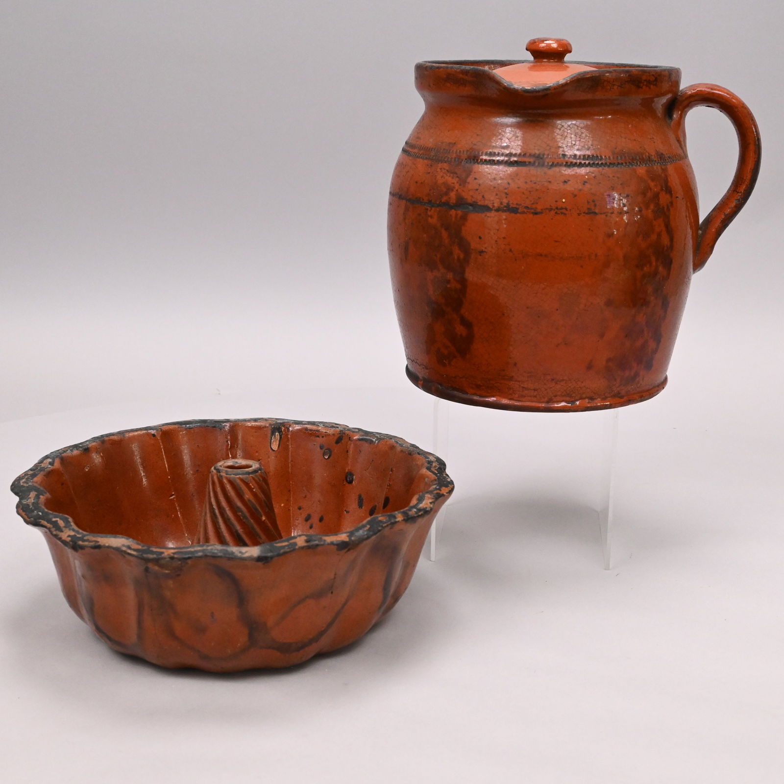 Glazed Redware Pitcher & Lid, Attrib. PA & a Mold: Glazed Redware Pitcher and Lid, Attributed to the Haig Pottery, Philadelphia; and a Turk's Head/ Cap Mold, Probably Pennsylvania, Mid-19th Century. The pitcher of ovoid form with narrow footed base