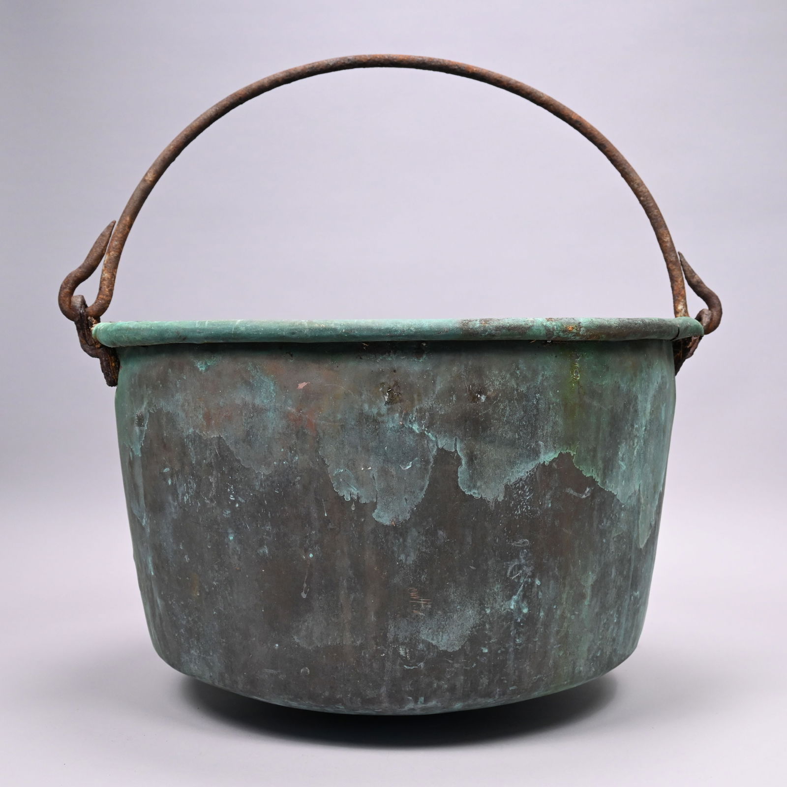 American Copper Apple Butter Kettle: American Copper Apple Butter Kettle, 19th Century. With rounded bottom and wrought-iron swing handle.H: 14 in. (not including handle), Diam: 23 in.