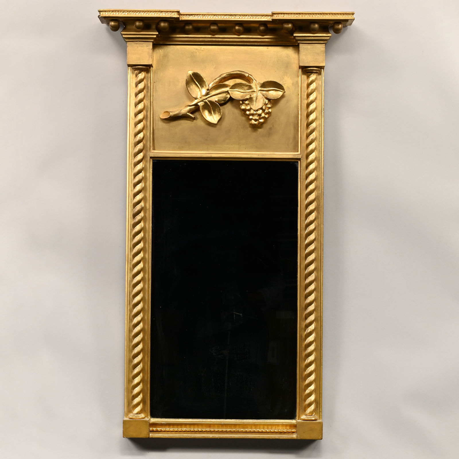 Federal Giltwood Tabernacle Mirror: Federal Giltwood Tabernacle Mirror, 19th Century. The rectangular mirror plate within rope-twist half columns on outset corners, the tablet applied with a grapevine, the outset crest applied with