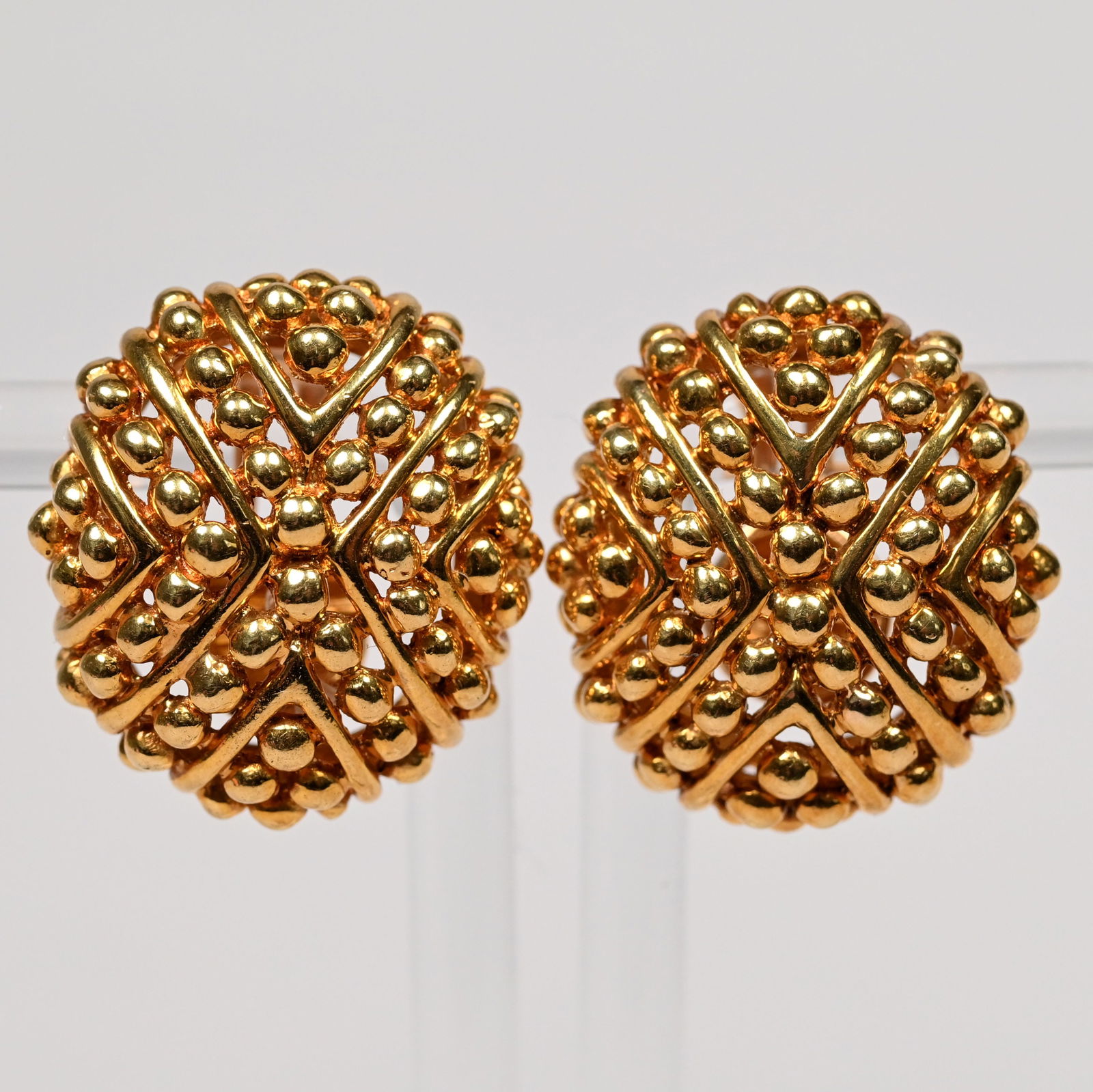 Pair of Modernist 18k Gold Clip-On Earrings: Pair of Modernist 18k Yellow Gold Clip-on Earrings. One inscribed "TIFFANY" and one inscribed "K18 ITALY."28g total weight1 x 7/8 in.