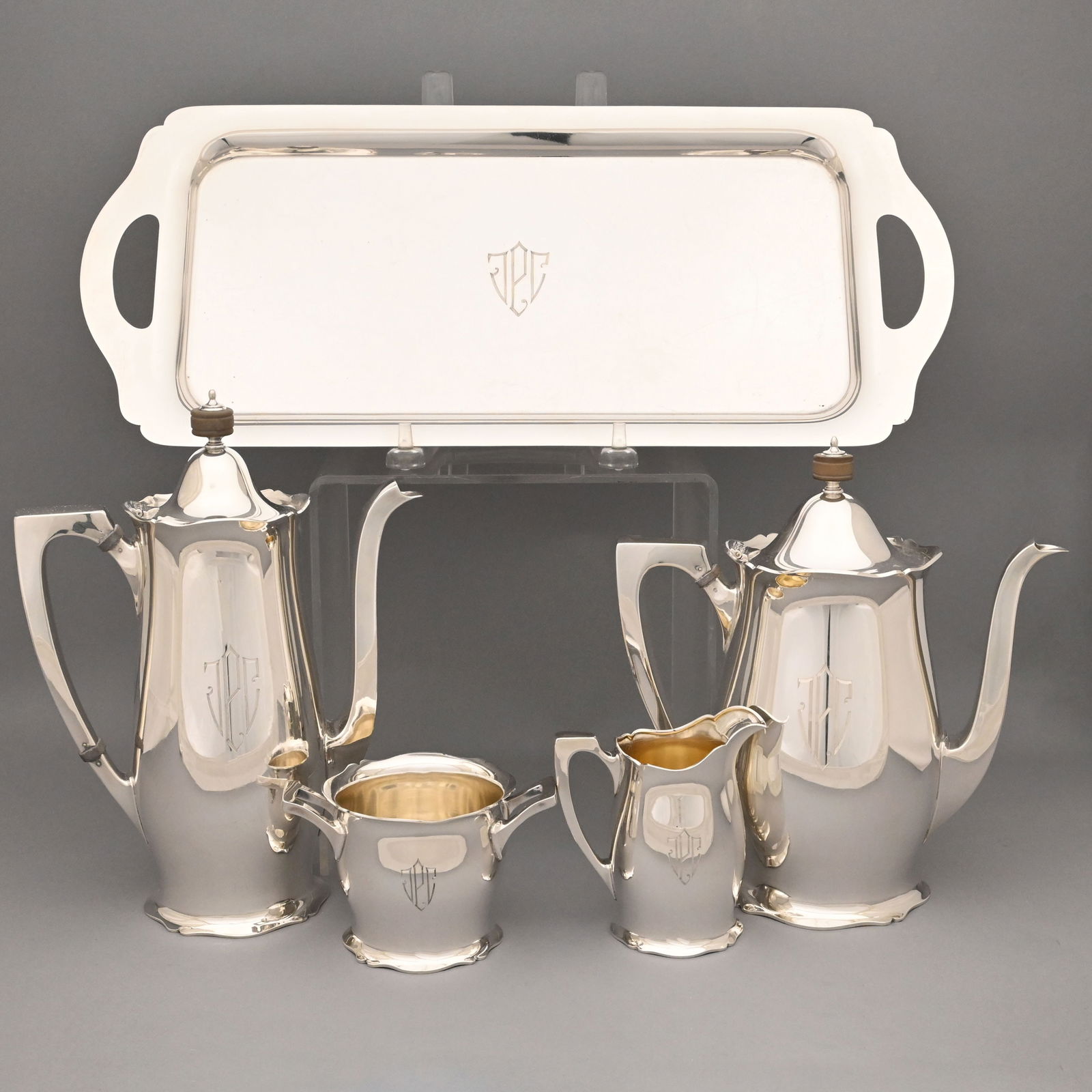 American Silver 'Antique' Tea and Coffee Service: American Sterling Silver 'Antique' Five-Piece Tea and Coffee Service, R. Wallace & Sons Mfg. Co., Wallingford, Connecticut, 1930-1950. Comprising a teapot, coffeepot, sugar bowl, cream pitcher with si