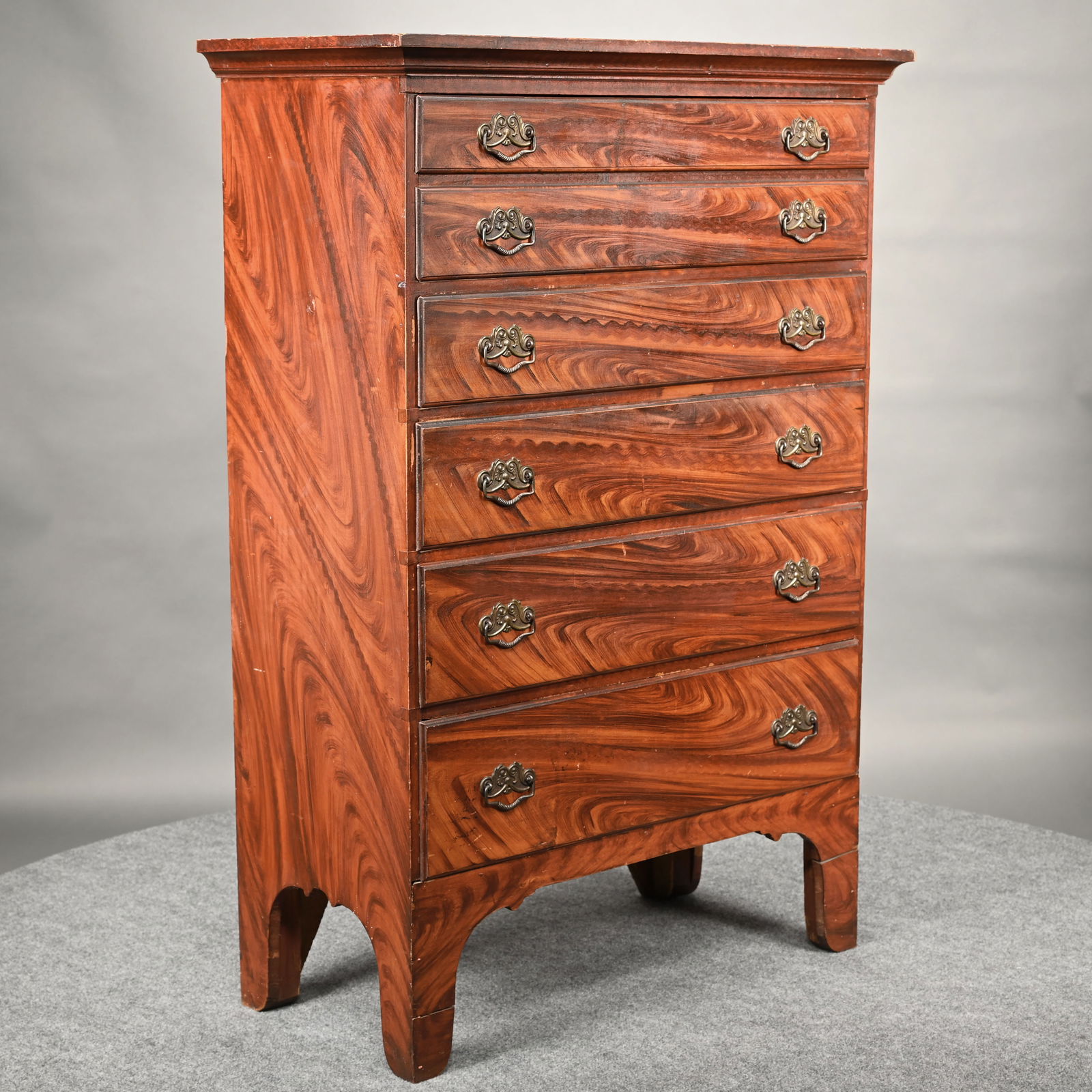 Exceptional Maine Federal Grain-Painted Tall Chest: Exceptional Maine Federal Grain-Painted Tall Chest. The molded rectangular cornice above one blanket drawer simulating two, over four molded graduated drawers, an arched apron and straight legs, the