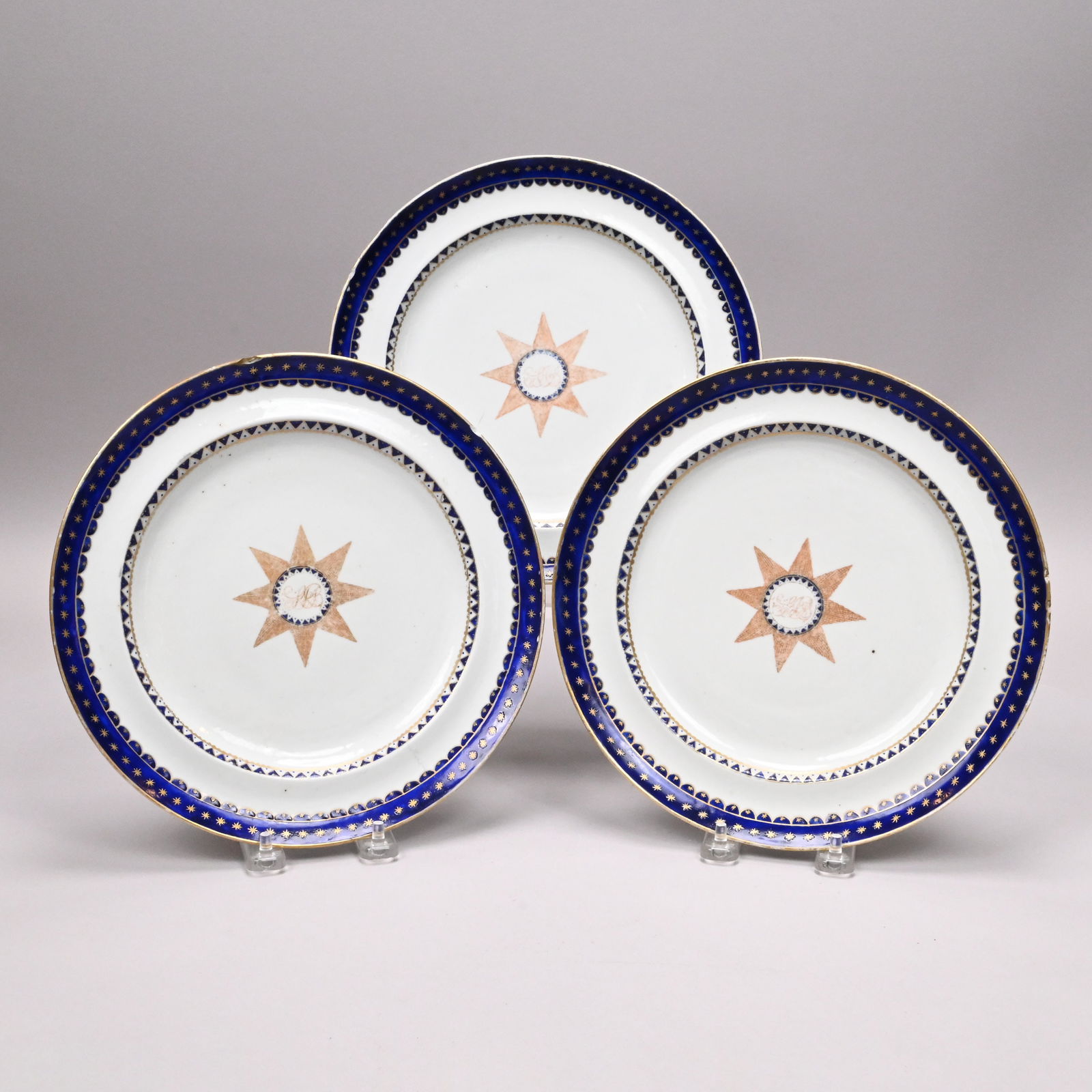 Set of Three Chinese Export Porcelain Plates,Breck: Set of Three Chinese Export Porcelain Plates From the Samuel Breck, Jr. Service, Philadelphia, Pennsylvania, Circa 1809. Each reserved in the center with a gilt-heightened iron-red eight-point star