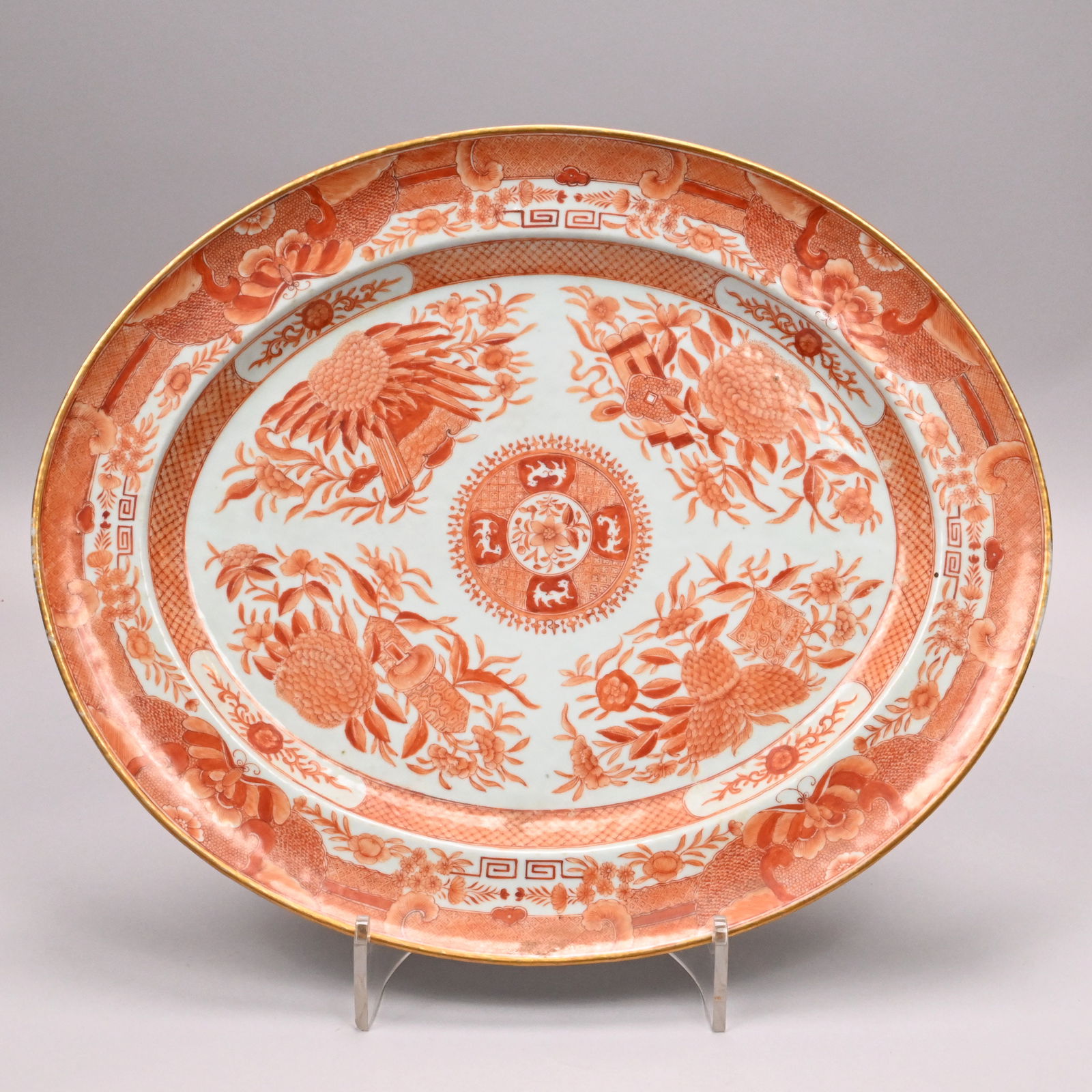Chinese Export Porcelain Orange Fitzhugh Platter: Chinese Export Porcelain Orange Fitzhugh Oval Platter, 1800-1815. Painted with a flower blossom roundel surrounded by four panels of stylized quilins, reserved on a trellis diaperwork ground edged by