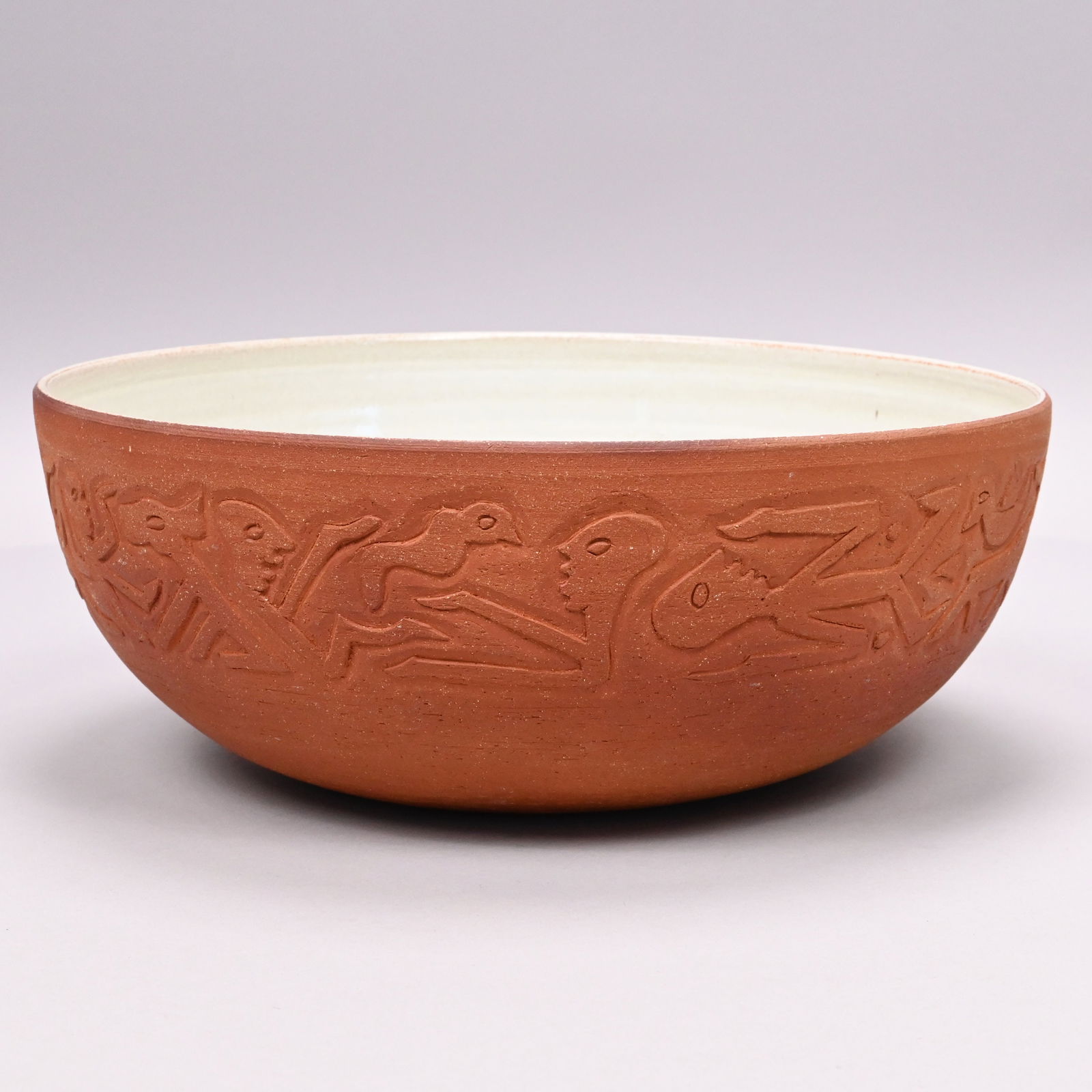 Edwin O. and Mary G. Scheier - Stoneware Bowl,1945: Edwin O. Scheier (1910-2008) and Mary Goldsmith Scheier (1908-2007), Durham, New Hampshire. Red Earthenware Bowl, 1945. Carved around the sides with thin angular male and female full and half