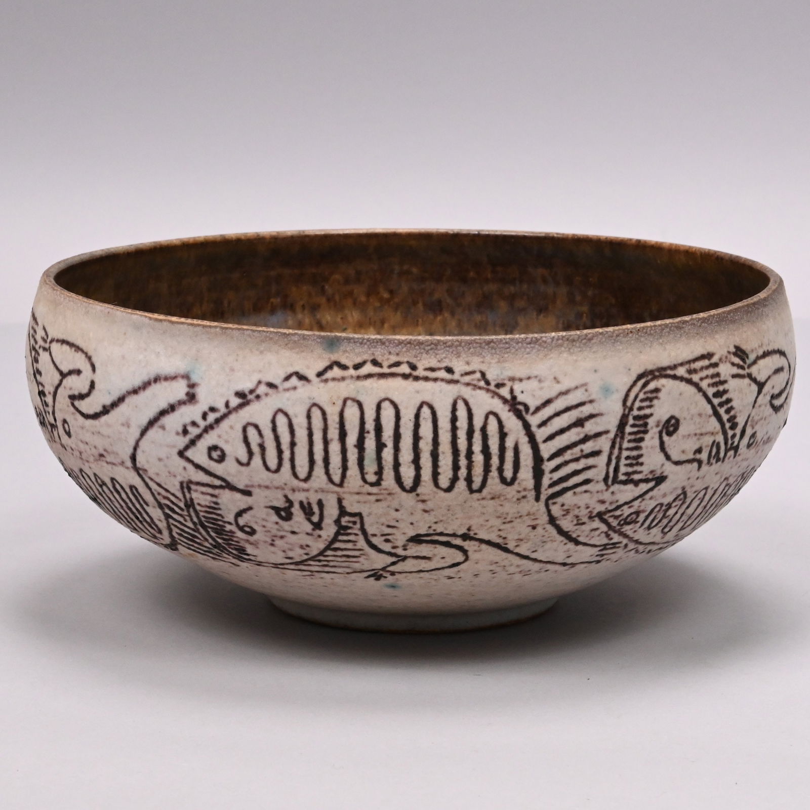 Edwin O. and Mary G. Scheier - Stoneware Bowl: Edwin O. Scheier (1910-2008) and Mary Goldsmith Scheier (1908-2007), Durham, New Hampshire. Glazed Stoneware Bowl, 1950s-1960s. Covered in off-white glaze, decorated in sgraffito through the glaze