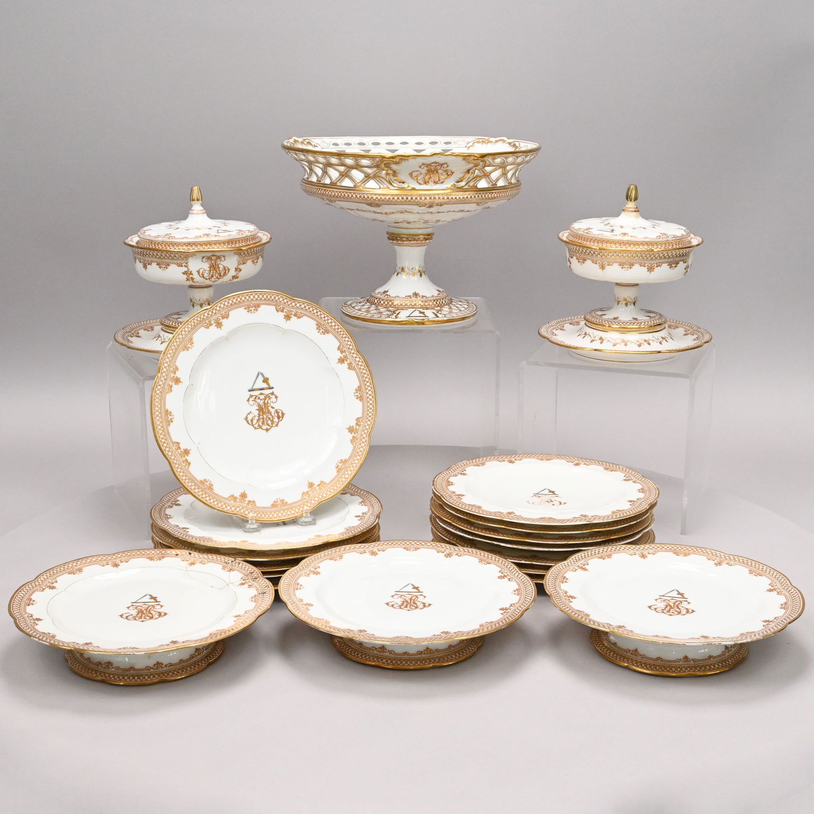 French Porcelain Crested Dessert Service, Lerosey: French Porcelain Crested Dessert Service, Lerosey, Paris, Mid-19th Century. Comprising a fruit stand, three tazze, pair of circular sauce tureens and covers with fixed stands and thirteen 9.25-inch