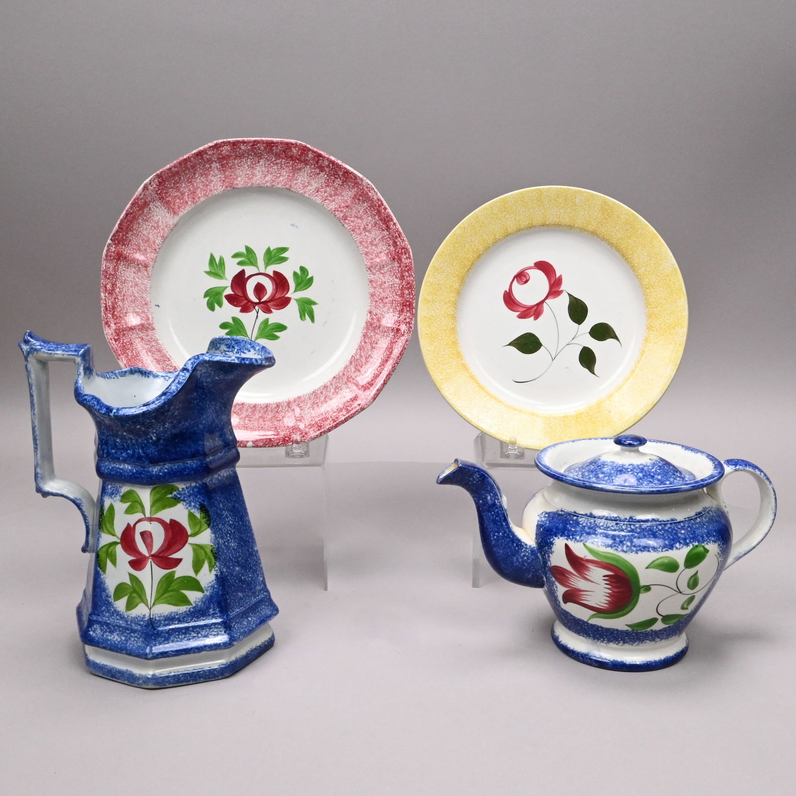 Four British Spatterware Serving Wares: Four British Spatterware Serving Wares, 1825-1850. Comprising a sponged blue teapot and cover reserved on each side with a horizontal "Tulip" in red and green enamels; a sponged blue pitcher and two