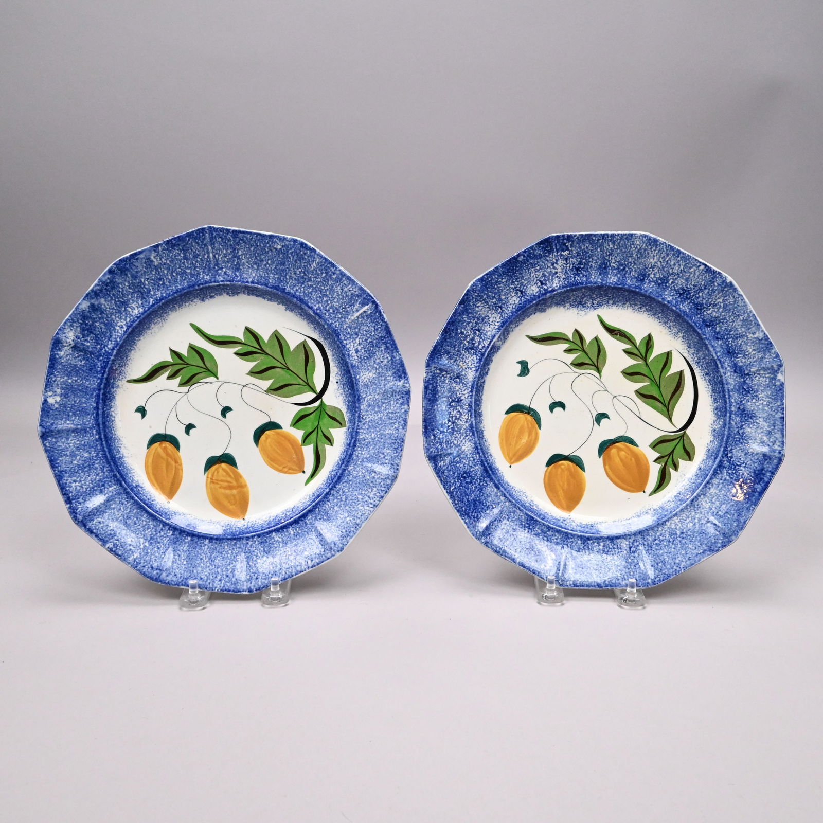 Pair of British Spatterware 'Acorn' Plates: Pair of British Spatterware 'Acorn' Plates, 1830-1850. Each painted in the center with an oak leaf stem bearing acorns in ochre, green and black enamels, within sponged green bands around the