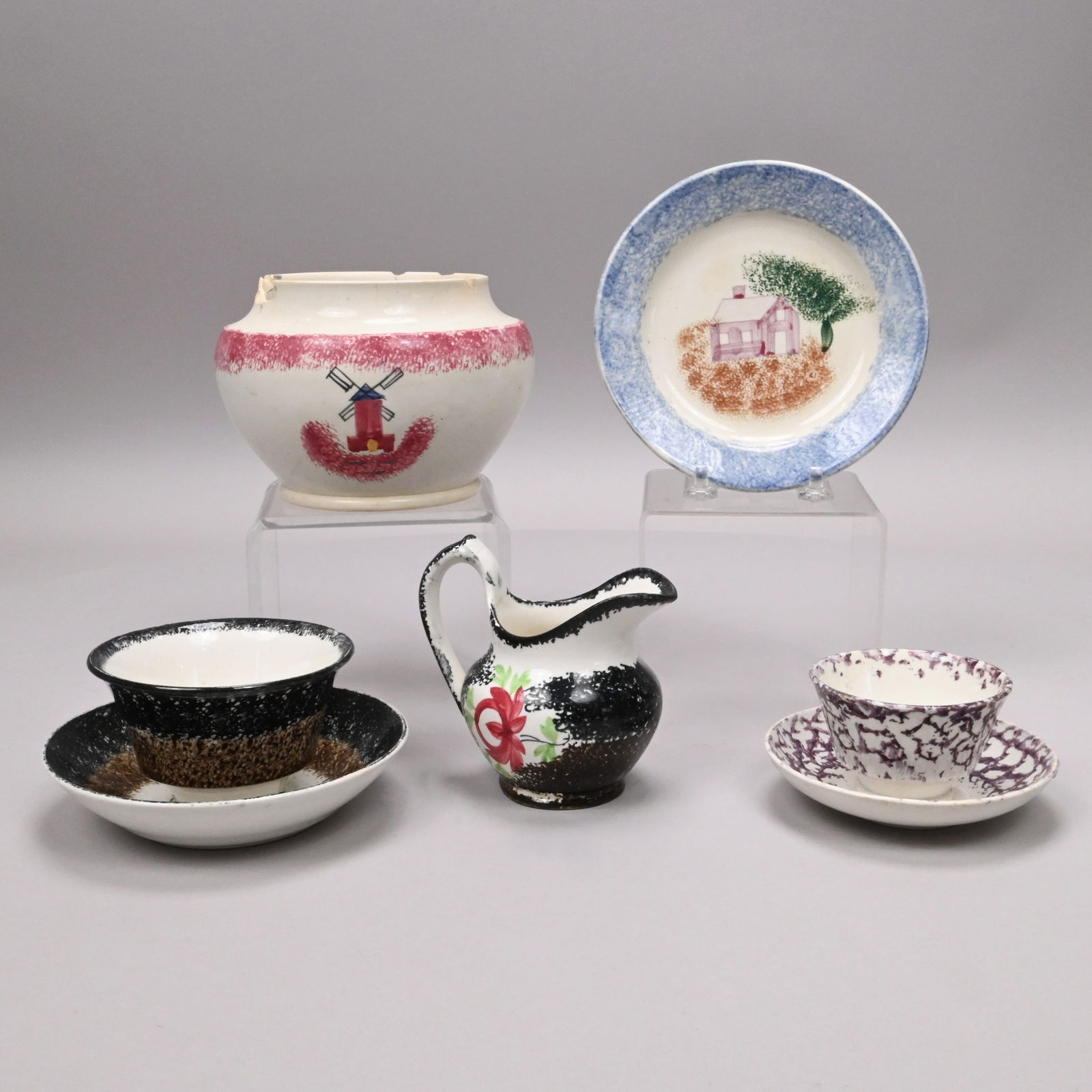 Seven English Spatterware and Painted Teawares: Group of English Spatterware and Painted Teawares, Second Half 19th Century. Comprising a 'Rose' handleless cup and saucer and a cream pitcher, each painted in red and green with a rose and sponged
