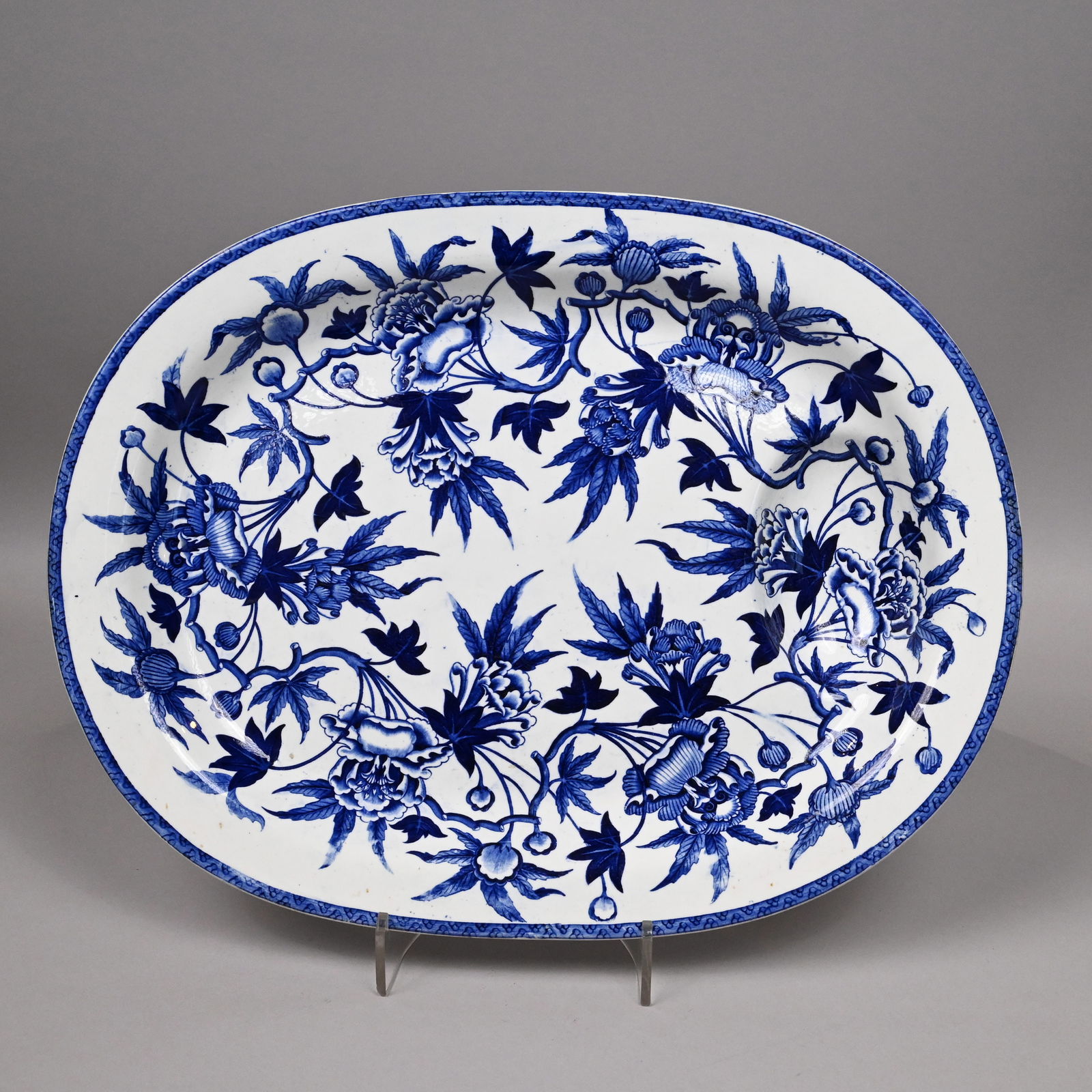 Wedgwood "Peony" Printed Well-and-Tree Platter: Staffordshire "Peony" Blue Transfer-Printed Well-and-Tree Platter, Wedgwood, 1815-1825. Impressed "WEDGWOOD." H: 15.5 in., L: 20.125 in., D: 3 in.
