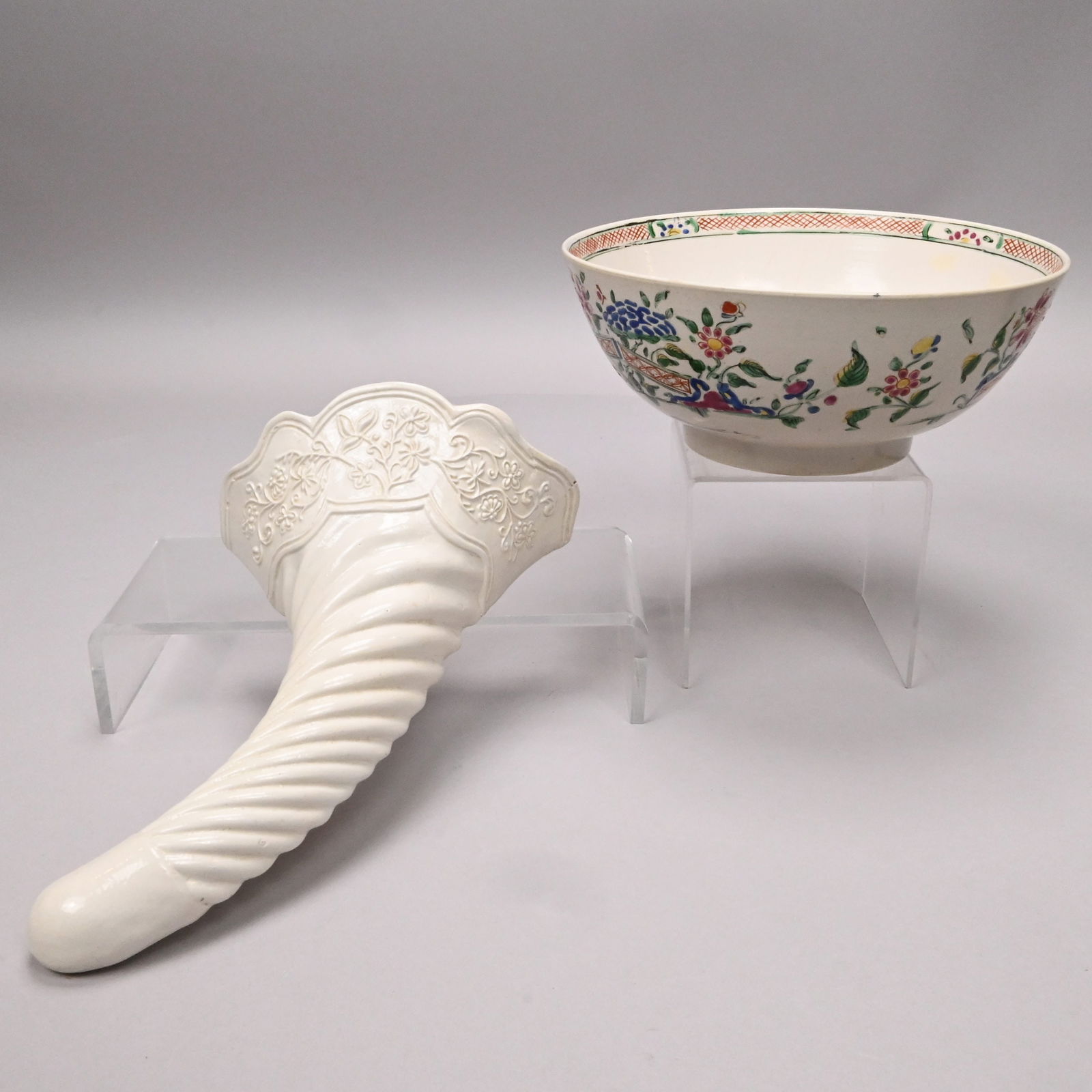 Staffordshire Saltglaze Bowl and a Wall Pocket: Staffordshire Saltglaze Stoneware Enamel-Decorated Bowl and a Wall Flower-Vase, 1755-1765. The bowl painted in rose, aubergine, blue, yellow, green and black enamels on the interior with a peony