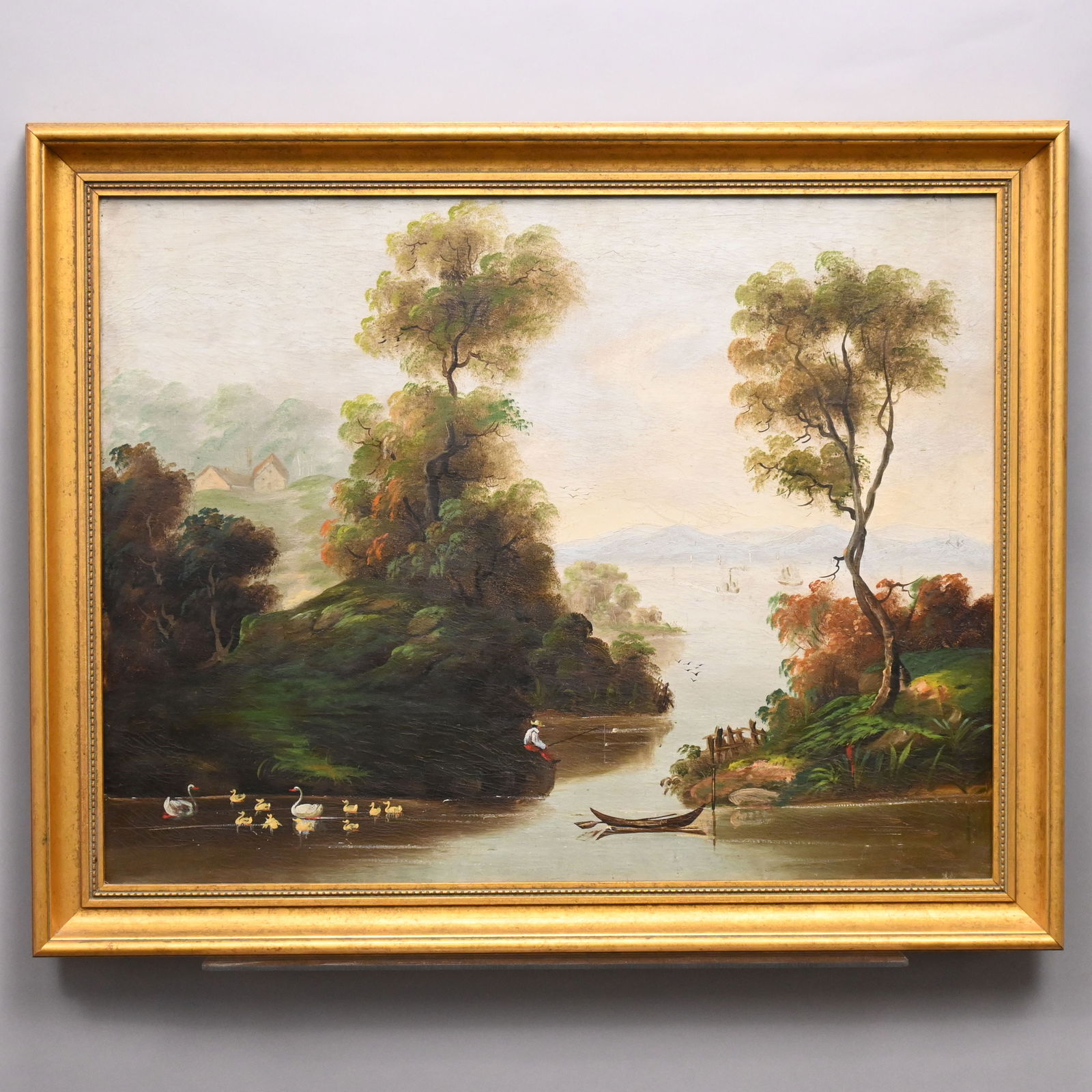 Riverscape with Fisherman, American School: Riverscape with Fisherman, American School, Late 19th Century. Oil on canvas, (24.25 x 31 inches).Frame: H: 24 in., W: 31.25 in., D: 2.5 in.