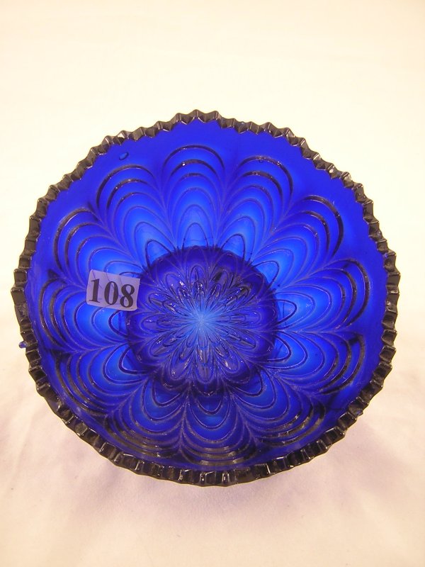Rare Cobalt Blue Peacock Tail 4.75" d. sauce dish,: Rare Cobalt Blue Peacock Tail 4.75" d. sauce dish, ca. 1910-12. This piece would ordinarily be iridized to create Carnival glass, but this piece was not iridized.