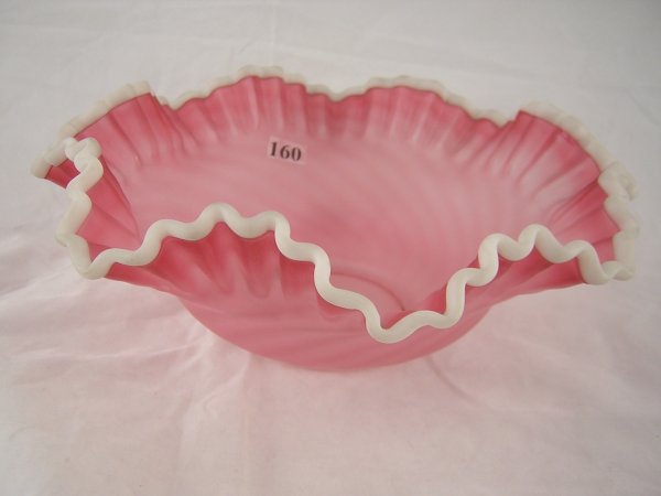 Rare sample: Satin-finished Cranberry spiral optic: Rare sample: Satin-finished Cranberry spiral optic 10" d. double-crimped bowl with Milk Glass crest. This piece was made in the late 1960s using an L. G. Wright mould.