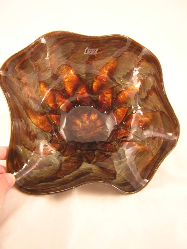 Frank Workman sample: Made by glass artisan Frank: Frank Workman sample: Made by glass artisan Frank Workman, this 11.5" d. free form bowl displays wonderful muted colors—green and dark orange inside and dark blue/green outside—all created by spec