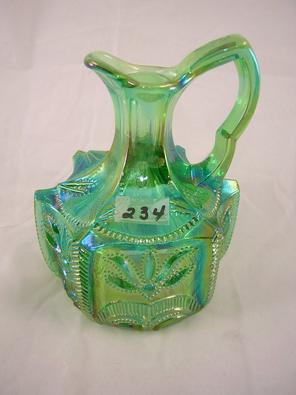 Sample: iridized Springtime Green Cactus pattern 5: Sample: iridized Springtime Green Cactus pattern 5" tall cruet (no stopper). Made for the Levay Distributing Co. of Edwardsville,Illinois, about 1977,this piece has a Fenton oval logo on its underside