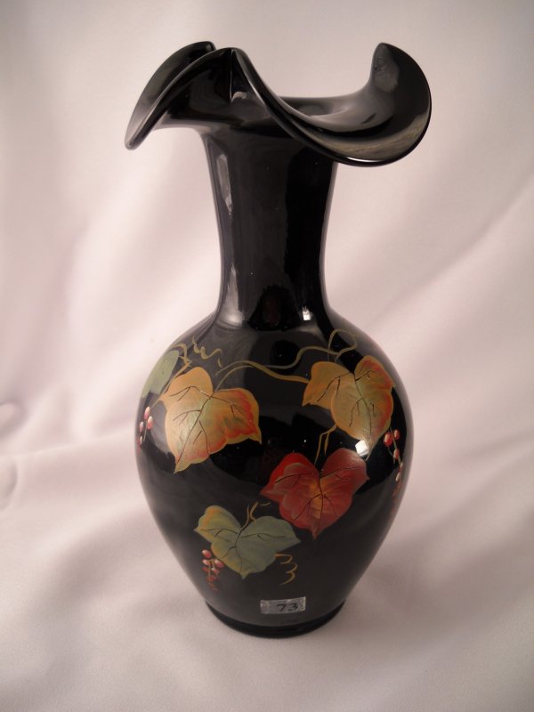 Black 9.5" tall vase with tri-crimp and handpainted: Black 9.5" tall vase with tri-crimp and handpainted fall leaves motif. This vase is signed on the underside: "handpainted by L. Everson". This vase was available only through IQVC.com sales in 2002.