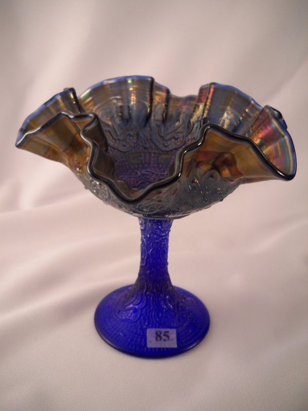 Blue Carnival glass Persian Medallion 6" tall compo: Blue Carnival glass Persian Medallion 6" tall comport, made ca. 1910-12. The stem is not iridized, and the double-crimped bowl has an interesting subdued iridescence to it.