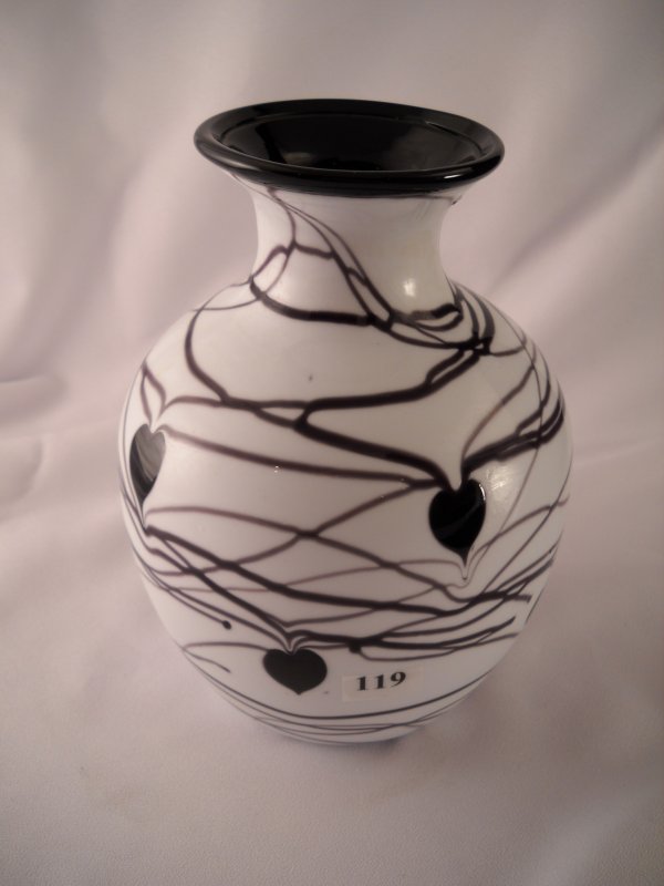 Dave Fetty vase: created by master glass artisan D: Dave Fetty vase: created by master glass artisan Dave Fetty, this 7.5" tall vase features random threading and absolutely perfect Hanging Hearts! The black glass used for these hand-applied decoration