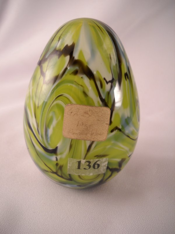 Robert Barber Egg: This 4.5" tall Egg is green gla: Robert Barber Egg: This 4.5" tall Egg is green glass with beautiful swirls created by black and Milk Glass encased in crystal. This Egg has a Fenton Museum acquisition number. The bottom area is groun