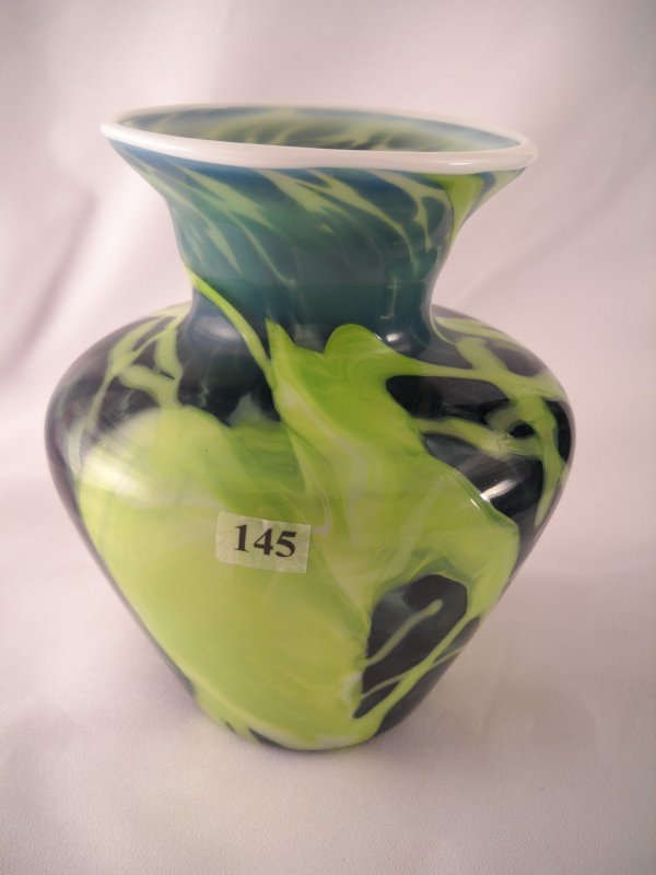 Frank Workman vase: Using Milk Glass and various c: Frank Workman vase: Using Milk Glass and various colors of green frit, glass artisan Frank Workman created this beautiful 7.25" tall vase. Note the applied Milk Glass edge. This vase is embossed with 