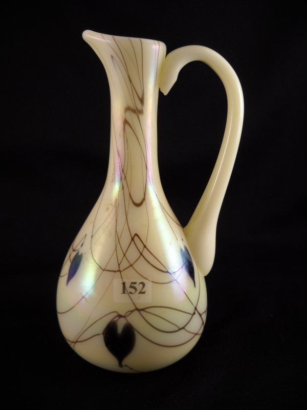 Robert Barber-era sample: this 8" tall offhand ewe: Robert Barber-era sample: this 8" tall offhand ewer is Custard glass with applied Hanging Hearts and random threading. The bottom has a rough pontil mark.