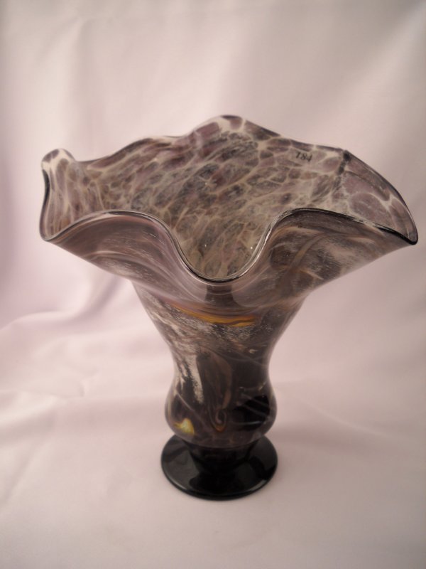 Frank Workman vase: Using crystal black glass alon: Frank Workman vase: Using crystal black glass along with white powder, glass artisan Frank Workman created this spectacular 10" tall vase, which has applied hot glass decoration and threading as well 