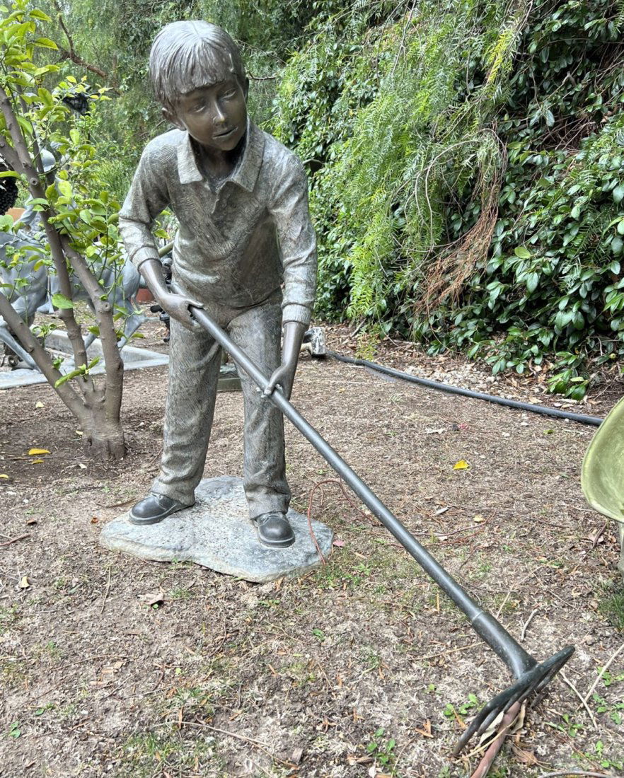 Life Size Bronze Boy Cleaning Leaves (1 of 2)