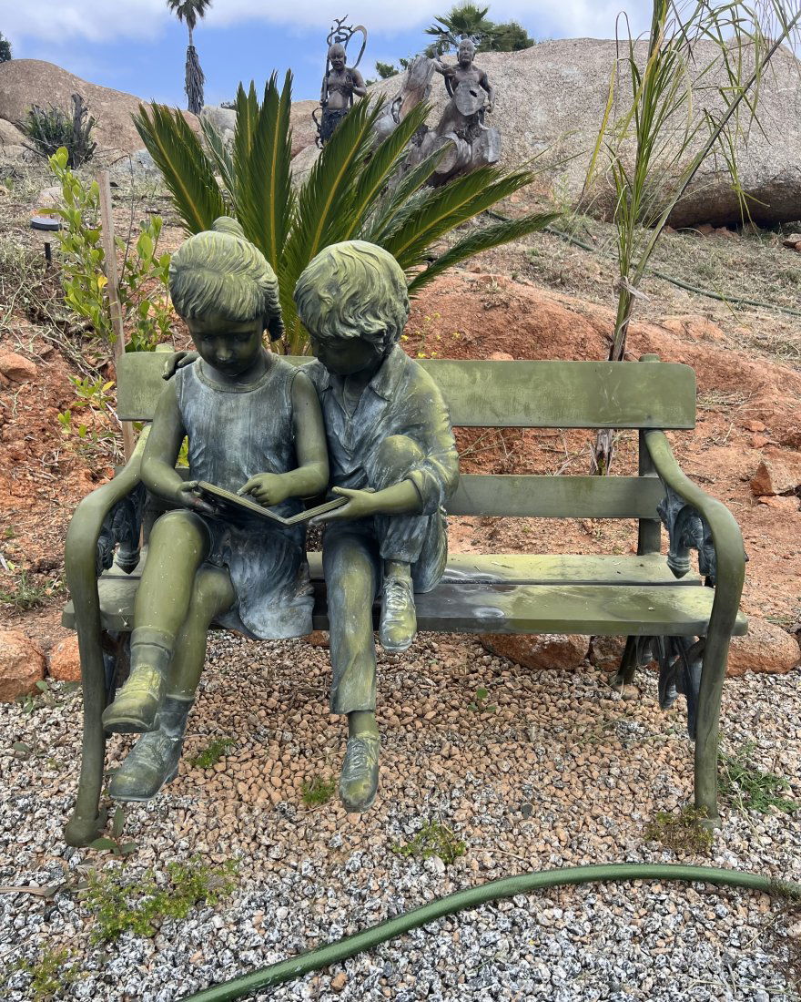 Life Size Girl and Boy Sitting on a Bench (1 of 4)