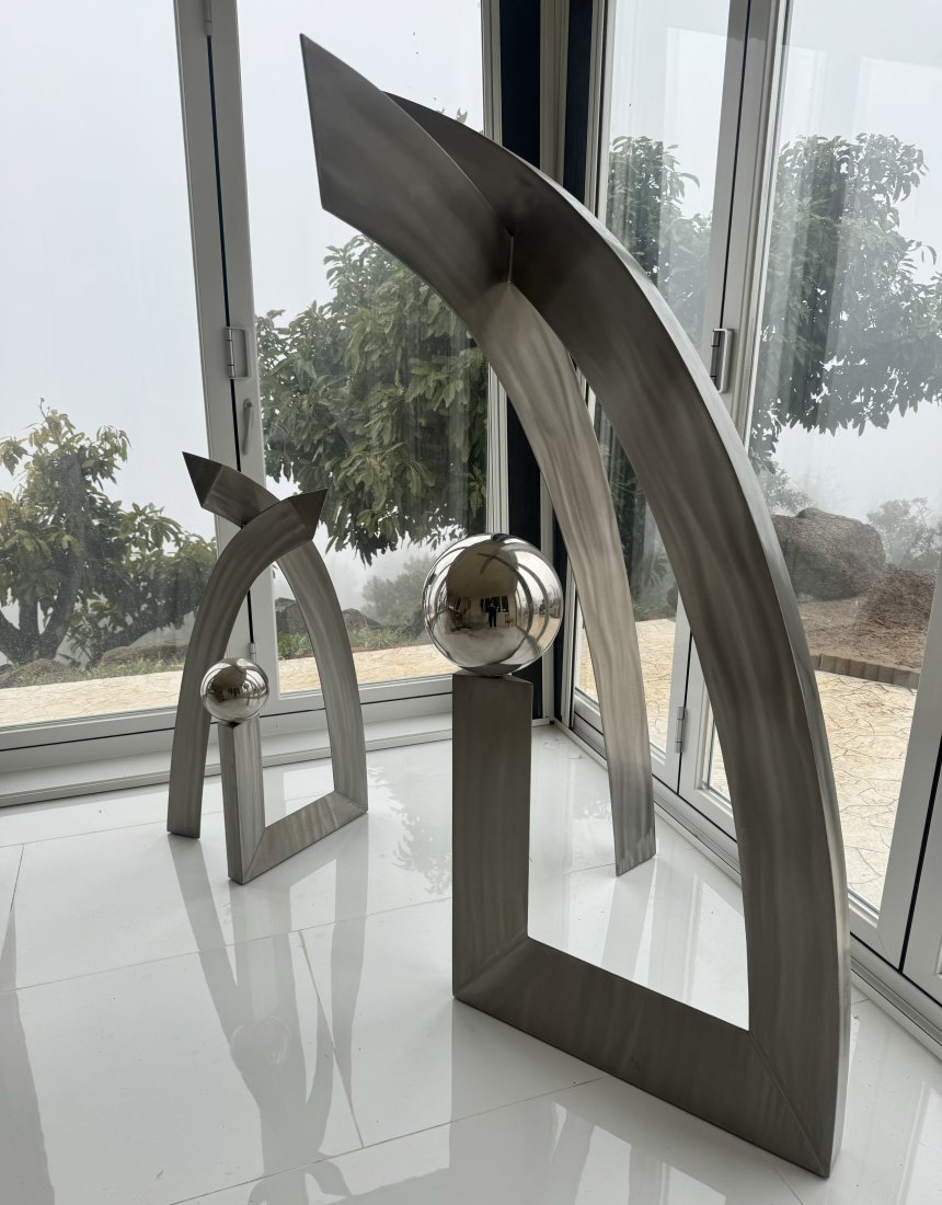 65 in H Arches of Inspiration Contemporary Modern Stainless Steel Sculptures: Measurements:Large: 65 in H x 41 in L x 23 Small one: 41 in H x 21 in x 14 in W