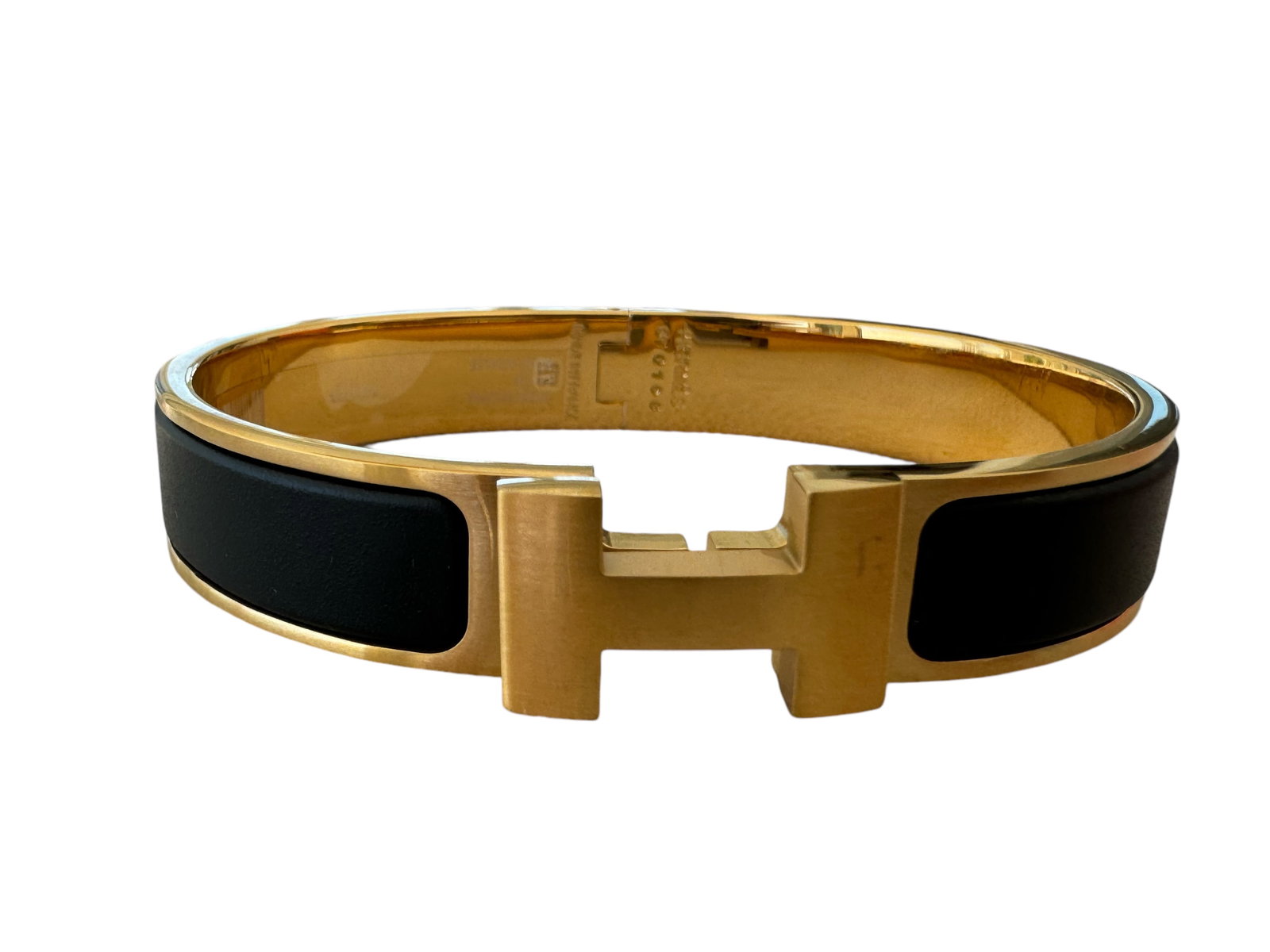 Hermes Black and Gold Bracelet: Includes box - Shipping only.