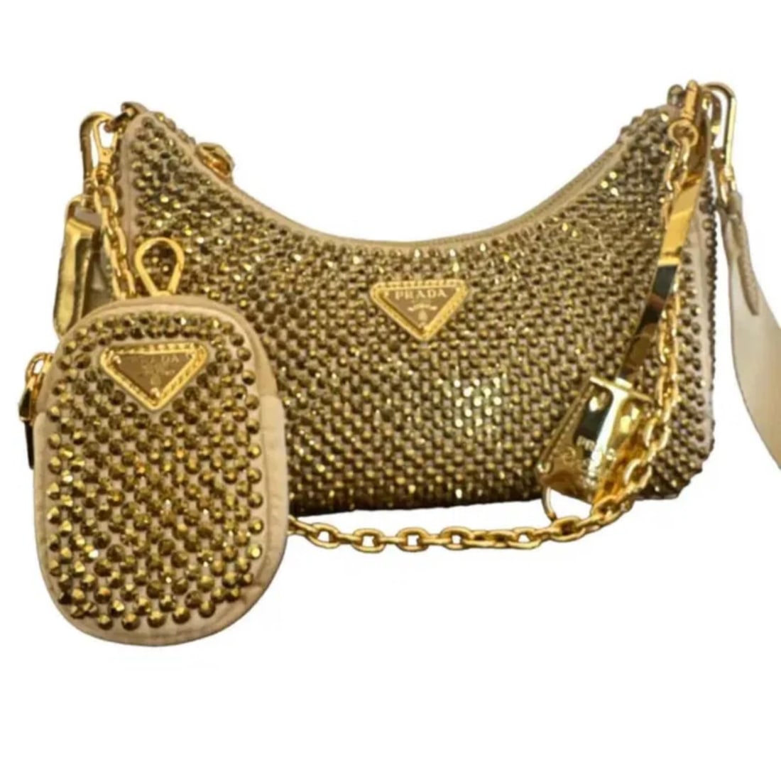 Prada Re-Edition 2005 Satin Crystal Platinum Gold Shoulder Bag: Measurementd: Height: 7"Length: 8.6"Depth: 2.5"Gold colored satin with crystals- Shipping available only. Shipping only.