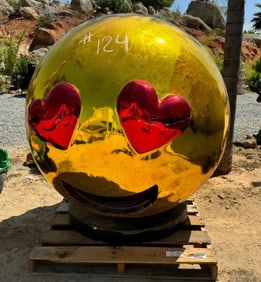 Giant Emoji Face with Heart Sculpture