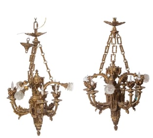 A pair of French cast-bronze Empire chandeliers