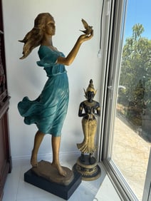 Life-size bronze Lady with Bird statue