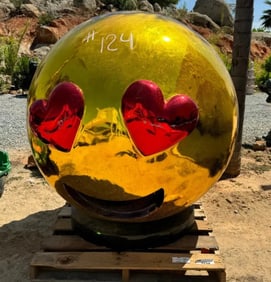 Giant Emoji Face with Heart Sculpture