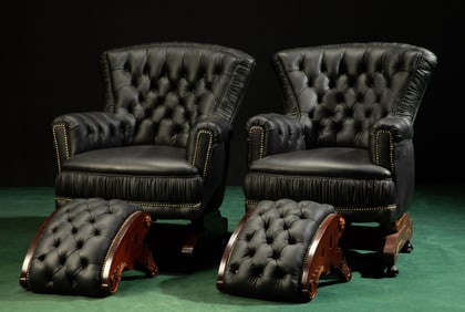 A pair of Victorian-style leather armchairs with footstools
