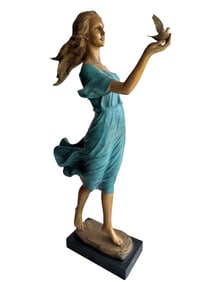 life-size bronze lady with birth statue