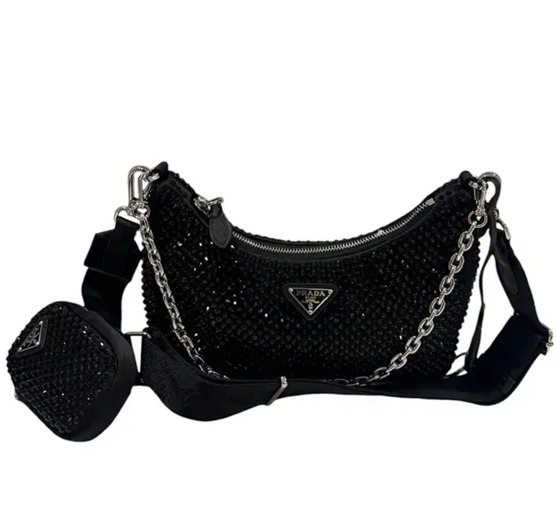 Prada Re-Edition 2005 crystal-embellished shoulder bag: Includes dust bag and box. - Black- Satin weave- Crystal embellishment- Enamel triangle logo- Silver-tone hardware- Internal logo plaque- Top zip fastening- Detachable chain-link shoulder strap- Adjus